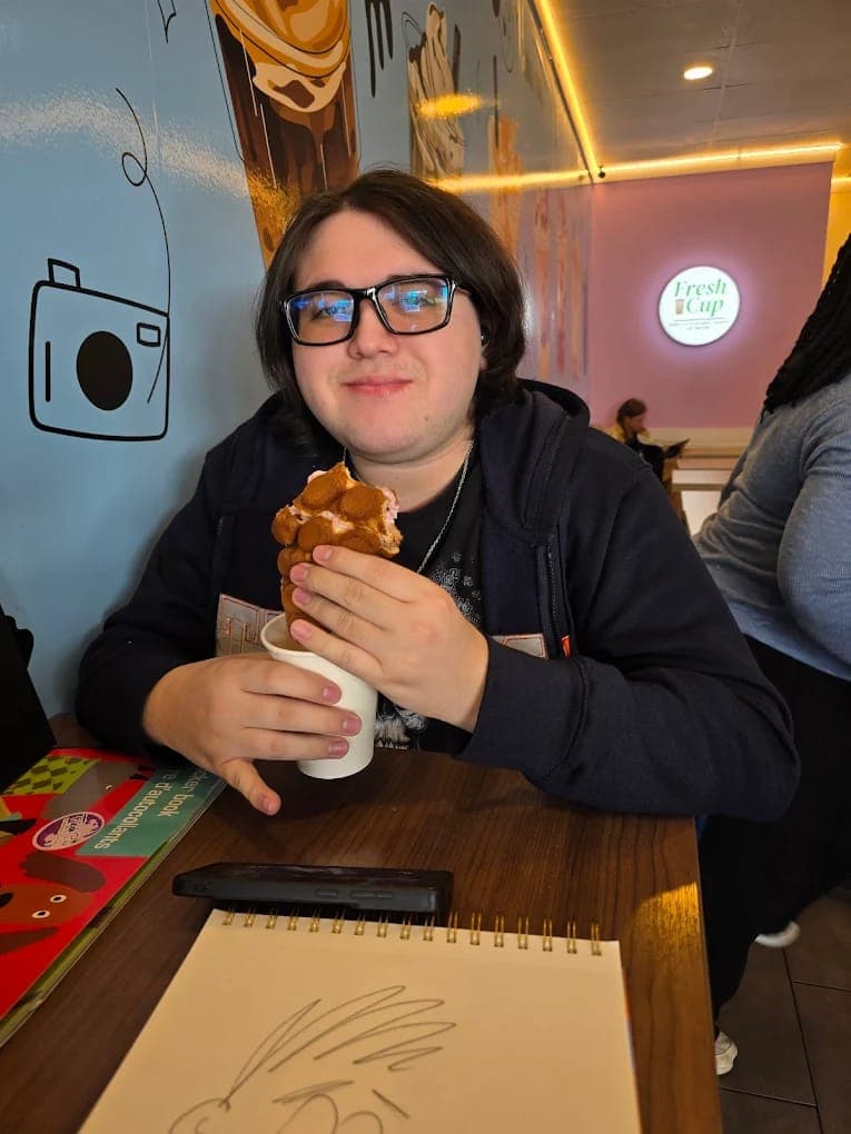 Fresh Cup customer holding a Hong Kong bubble waffle cup